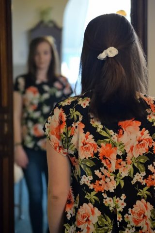 woman looking in a mirror