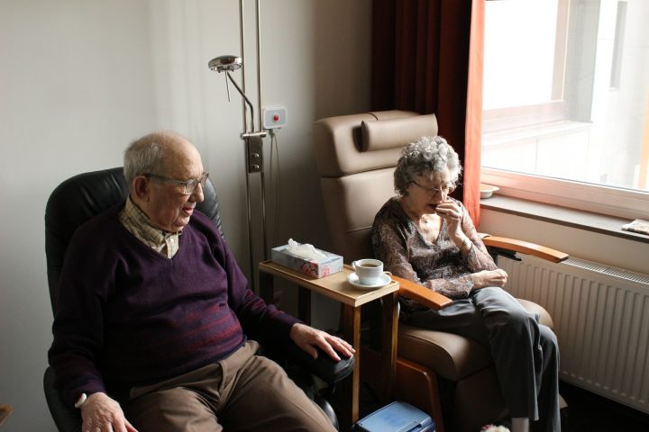 couple sat in hospital chairs